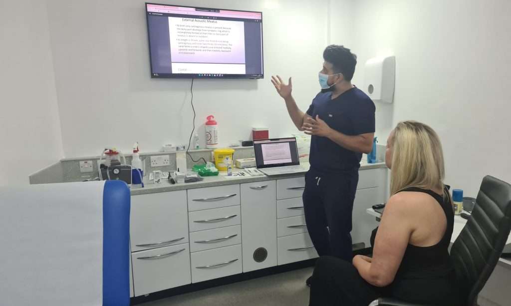 Close-up of an earwax removal procedure at Earwax Specialist clinic training center, featuring advanced tools & professional care