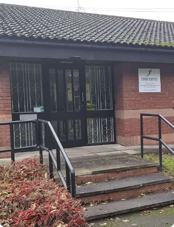 Earwax specialist cleaning ear with microsuction tool