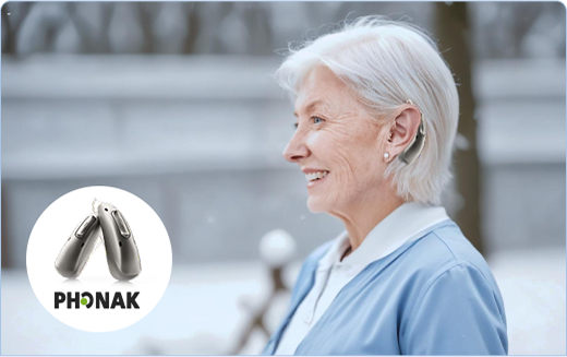 Selection of discreet in-ear and behind-the-ear hearing aids on display.